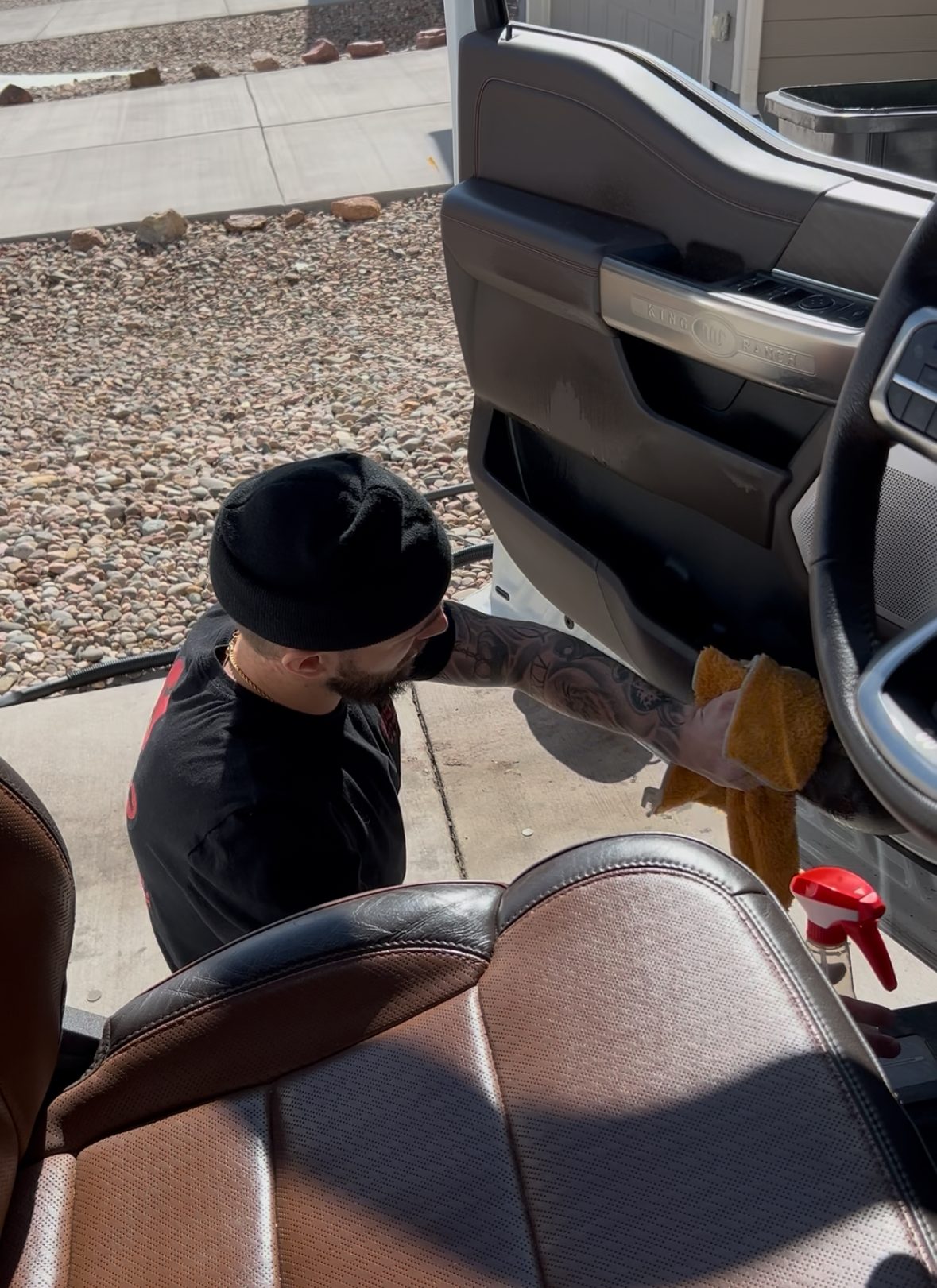 Wiping down a truck's leather door panel