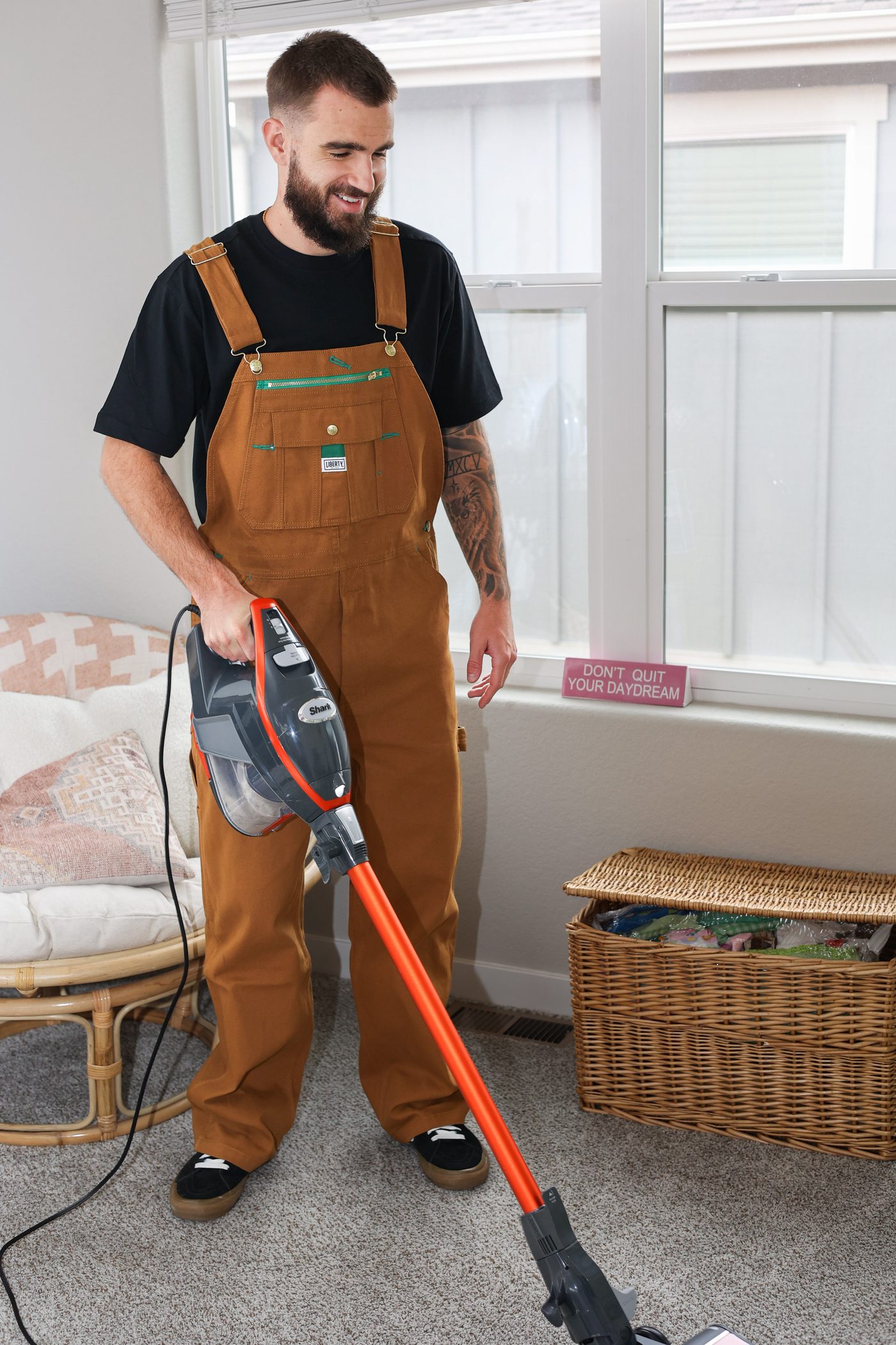 Vacuuming a living room carpet